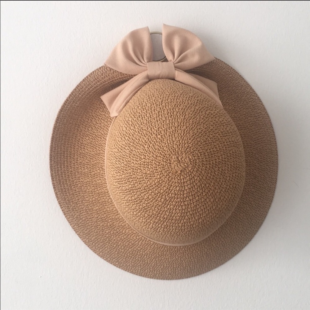 Summer now hat with mauve pink bow.